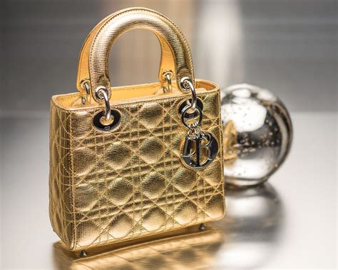 christian dior gold purse|Christian Dior purses on displays.